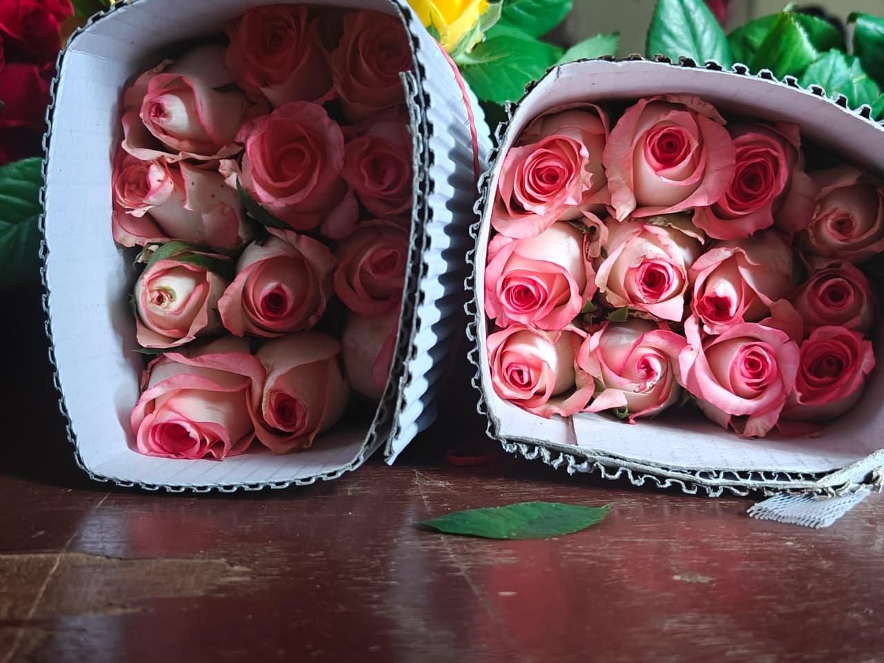 Cartons of pink roses ready for dispatch